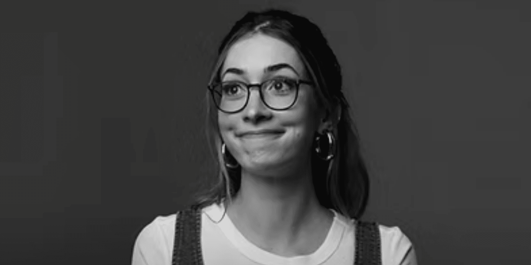 Cristina Mariani female musician in black and white close-up portrait wearing glasses