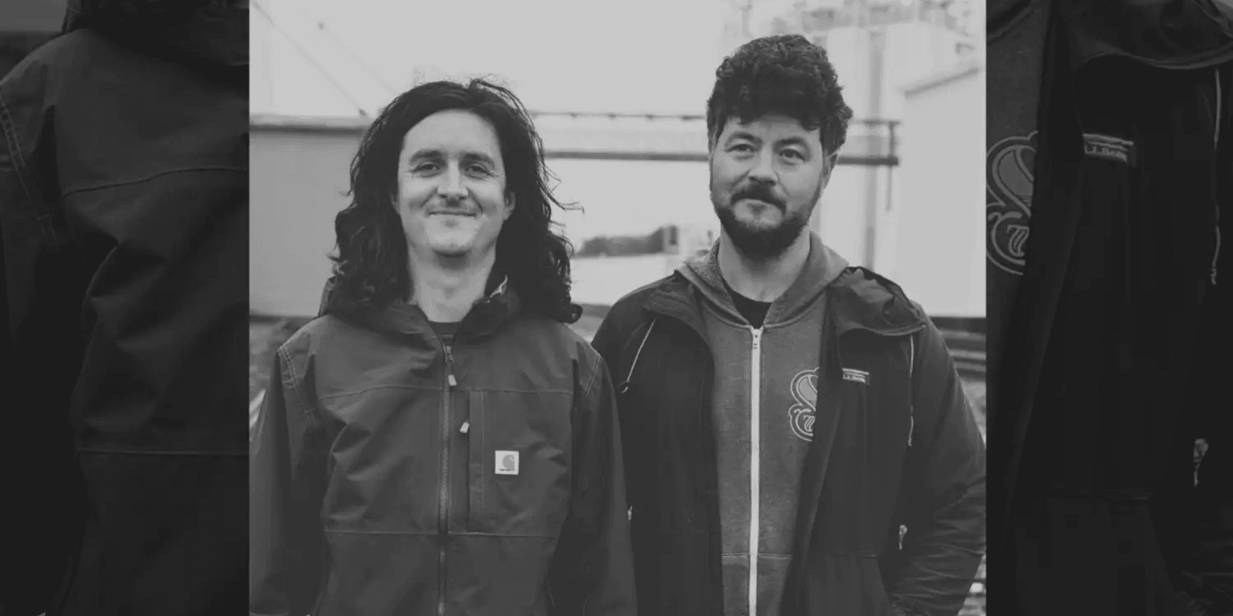 James Felice and William Laurence two male musicians in dark monochrome group portrait