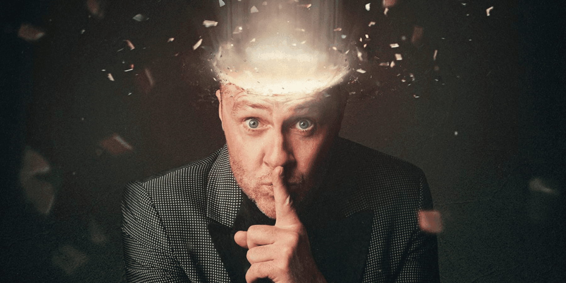 Keith Barry illusionist with dramatic light explosion effect erupting from head close-up