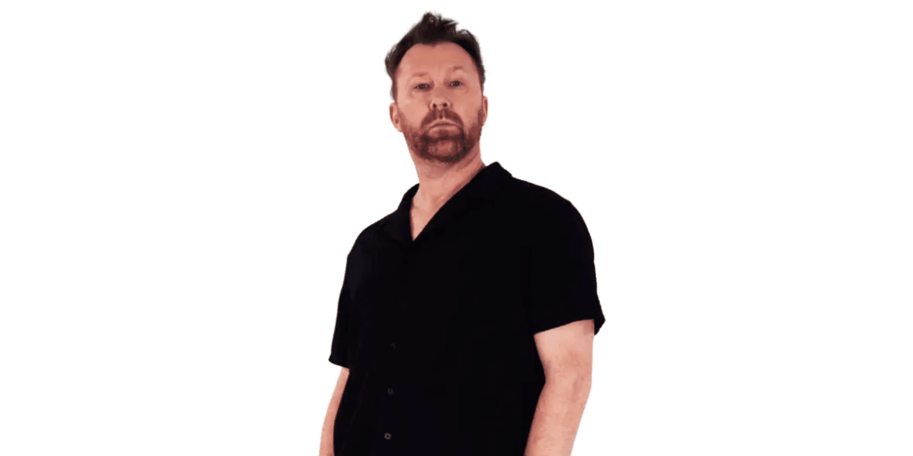 Jason Byrne stand-up comedian in black shirt against white background