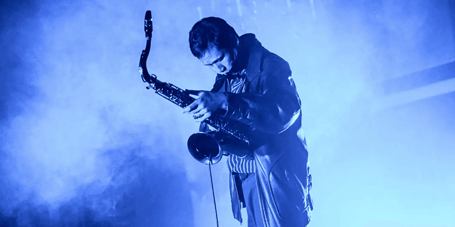 Alex Zhang Hungtai musician playing instrument on dimly lit stage